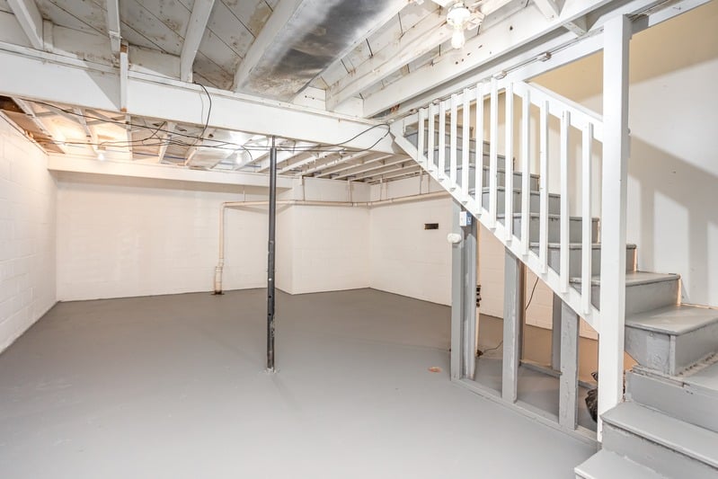 Bright basement stairway and finished lower level